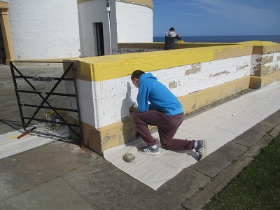 Students painting covesea lighthouse