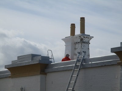 Students painting Covesea Lighthouse Lossiemouth